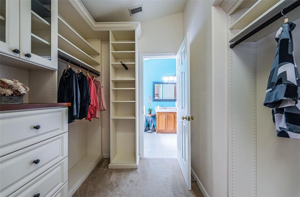 Primary bedroom, walk in California Closets,entry into primary bath en-suite