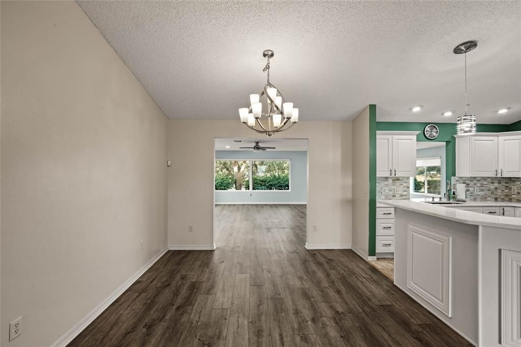 Dining Room with chandelier off kitchen