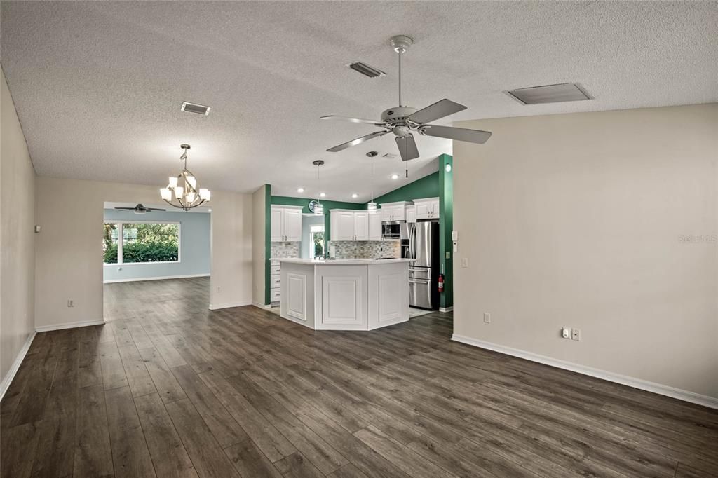 Upon entering the home, living room to the right, with kitchen off to the far right