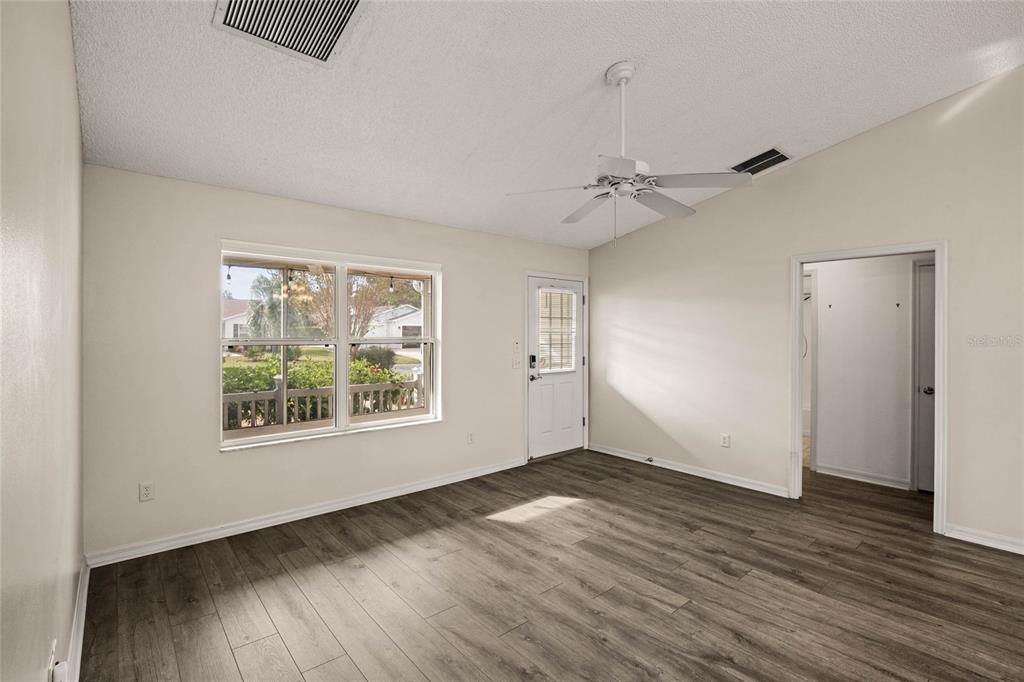 Front Living room looking into entry to secondary bedrooms and bathroom