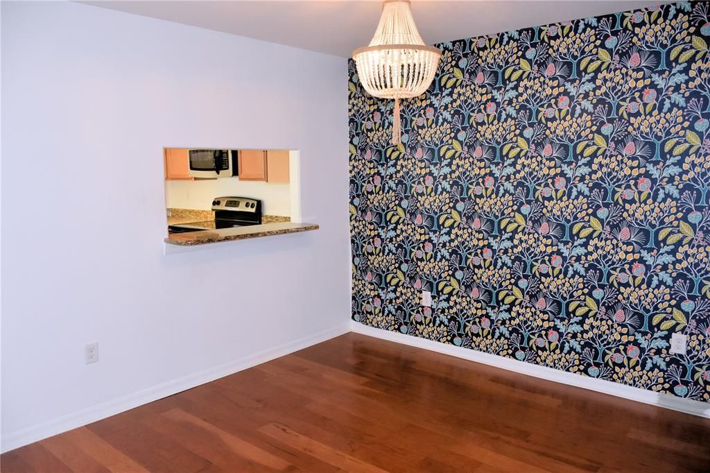 Dining room with view toward kitchen and breakfast bar