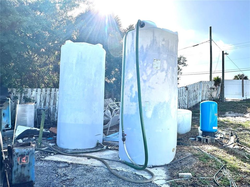 Outside 2 water tank storage, located toward the back of the property