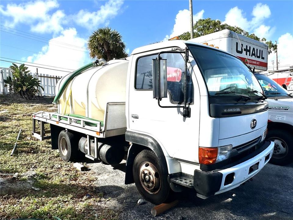 Water tank and truck- Comes with the sale, located toward the back of the property