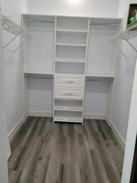 walk in closet with custom shelves