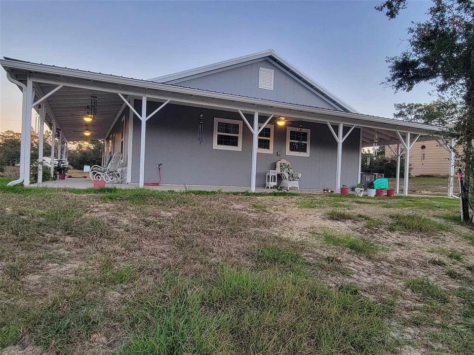 side covered porch with lights and fans