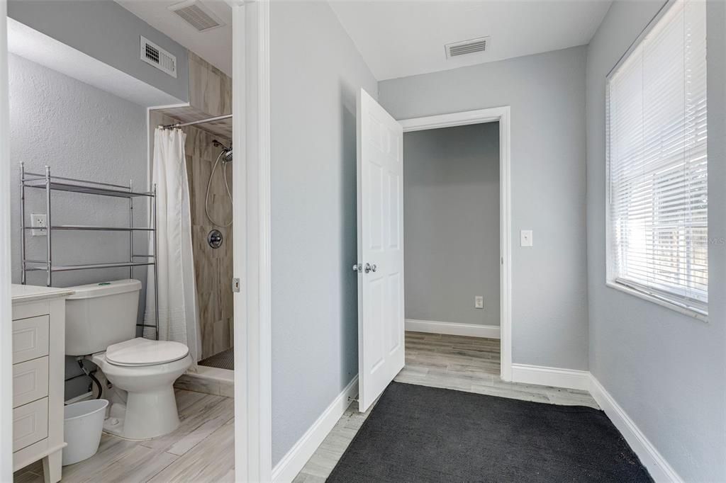 Primary Bathroom off Hallway leading into the Primary Bedroom