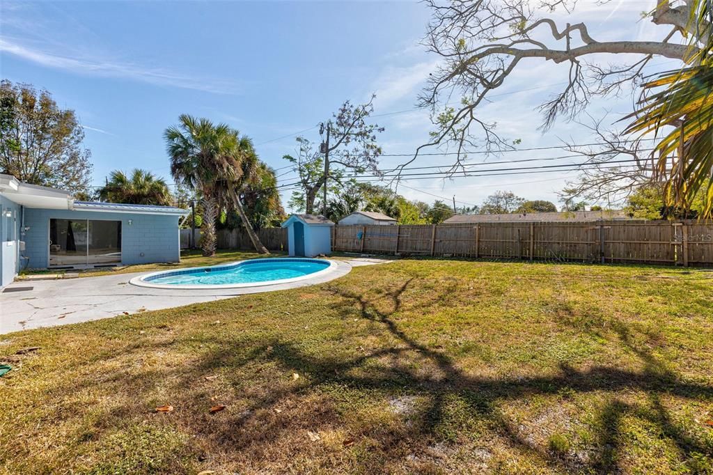 Left side of spacious backyard