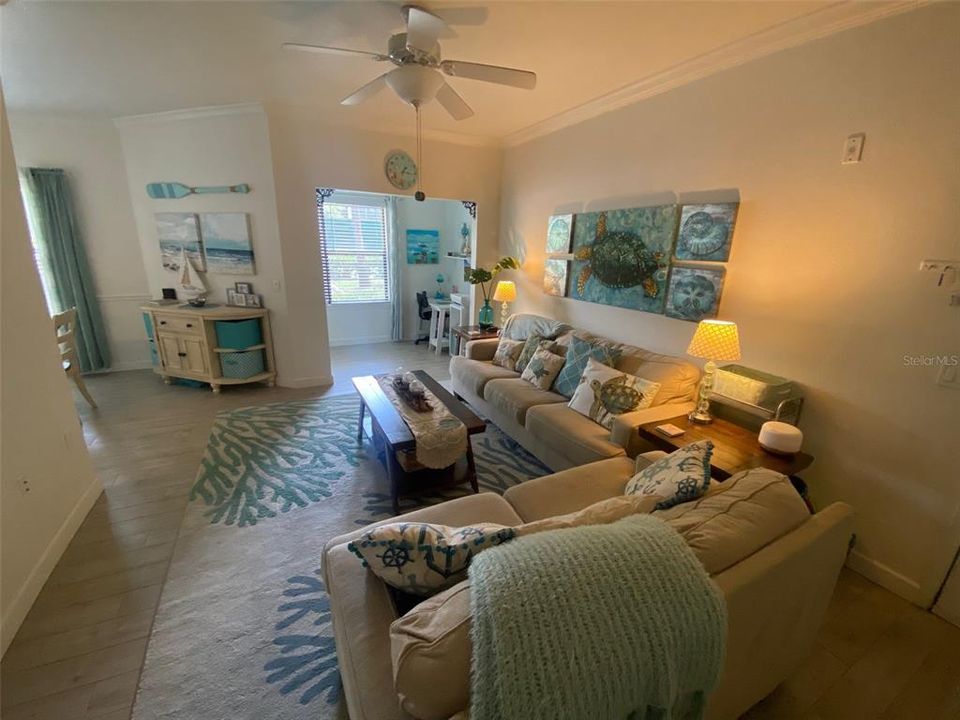 Living Room with Dining Room on Left and Office on Right