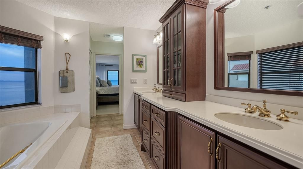 The Owner's Retreat Bath Area Features Attractive Cabinetry with His and Her Sinks.