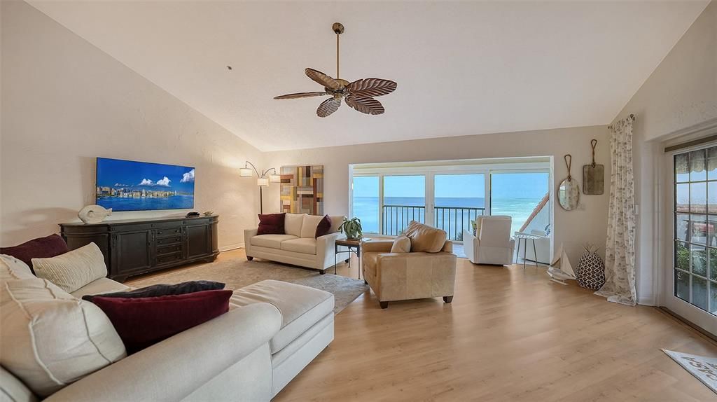 The Open Great Room with Vaulted Ceilings and french doors out to private rooftop terrace