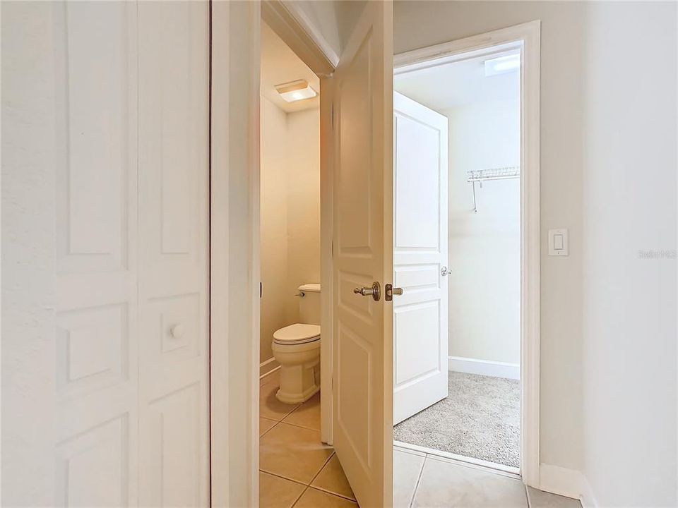 The water closet is located in a separate room near the walk-in closet.