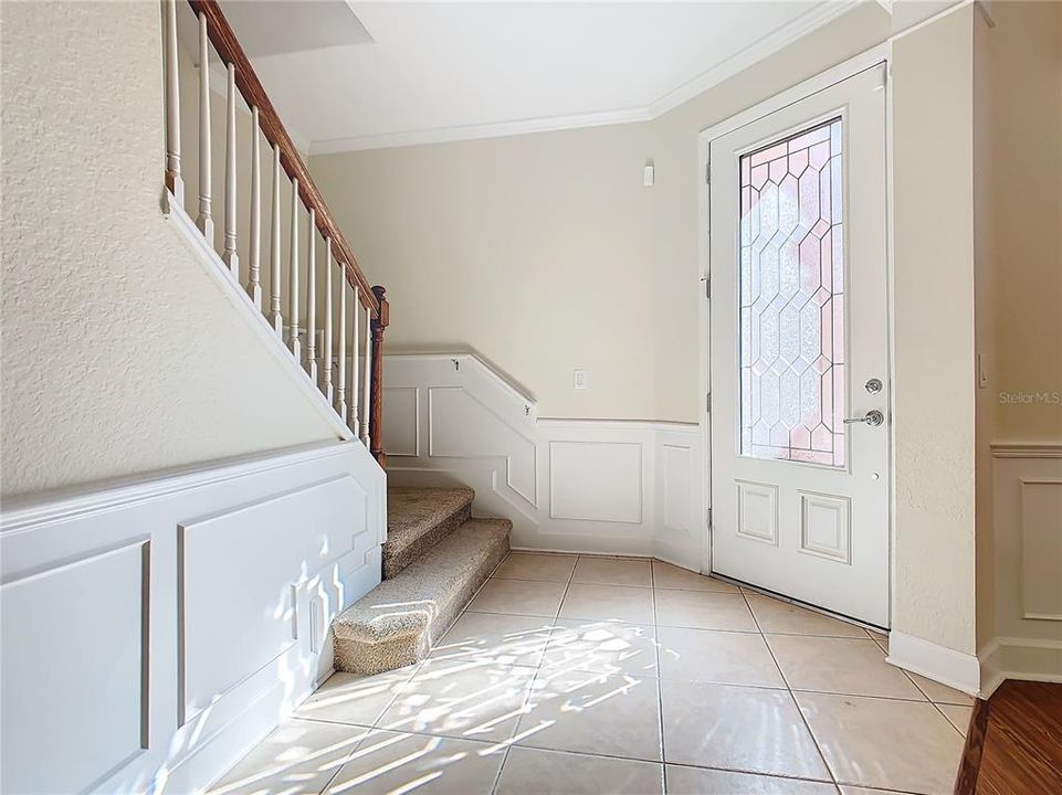 The front door will take you to the stairway to the second floor or the open floor plan of the dining/living/kitchen.