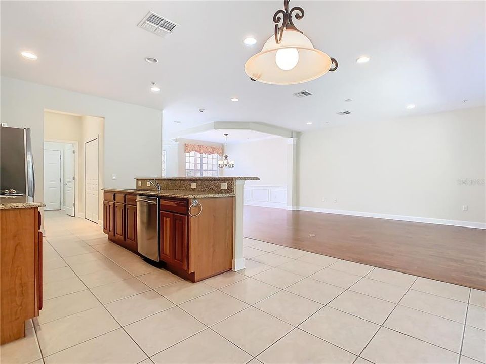 Showing how open the kitchen, living room, and dining room are.