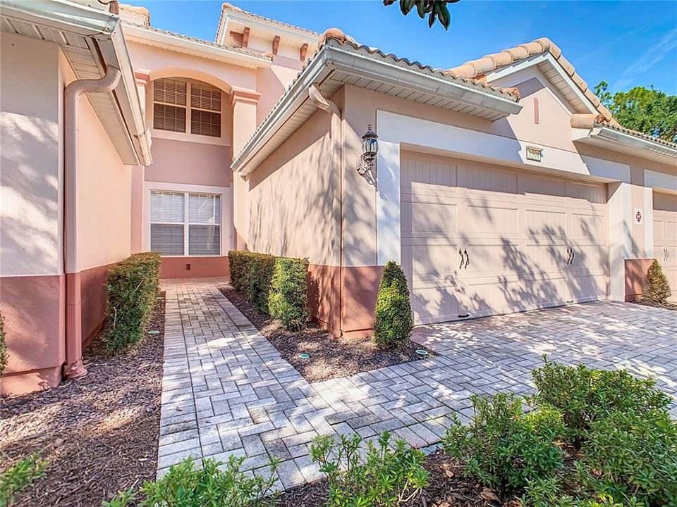 Guests will be guided by the brick paver driveway to the sidewalk leading up to the front door.