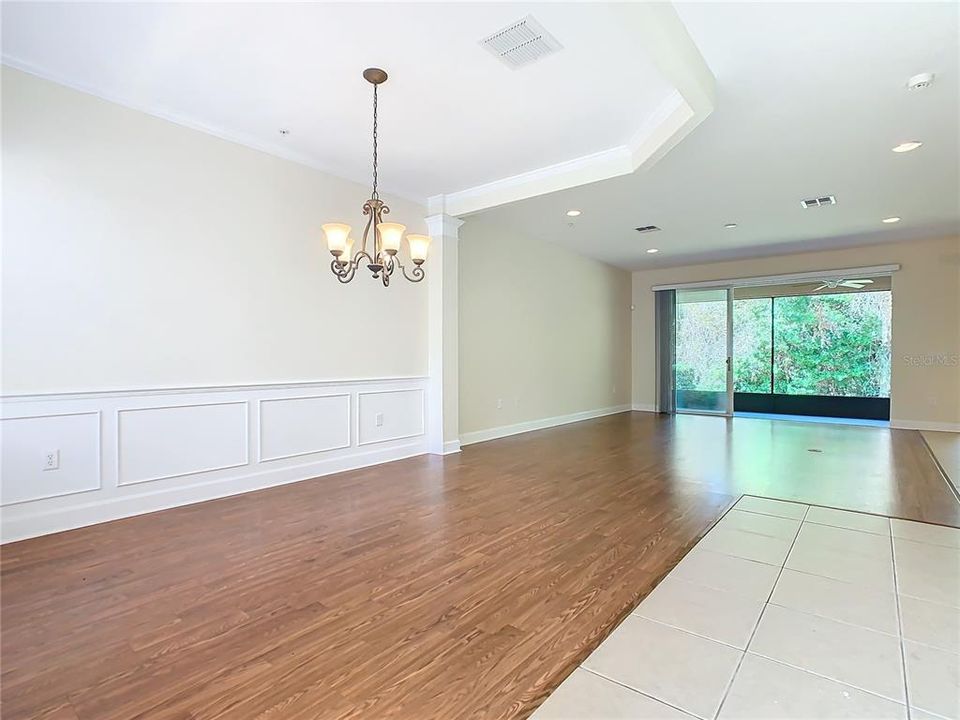 Open area with tile and laminate flooring which makes for easy cleaning.