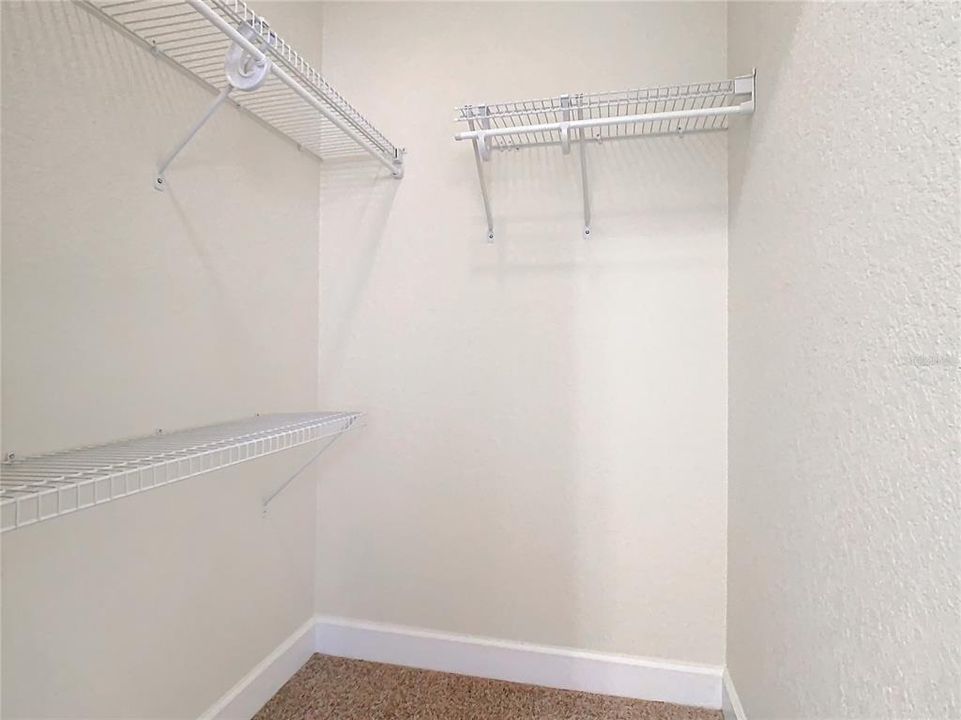 A walk-in closet in the guest bedroom.