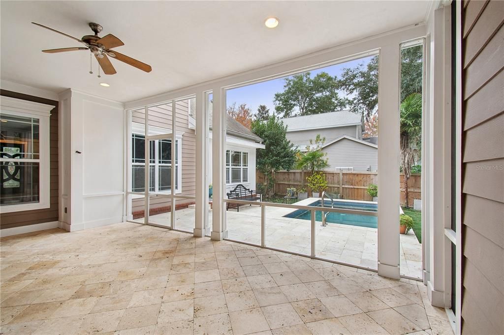 Screened porch overlooking pool area