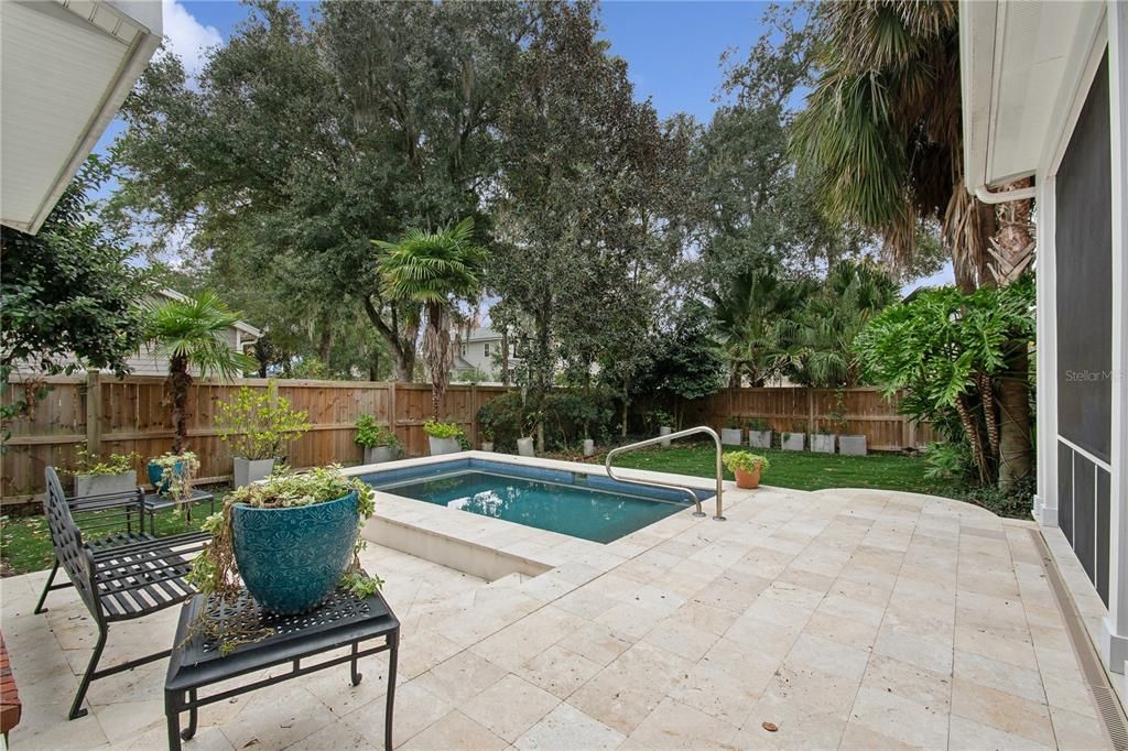 Pool area with travertine decking