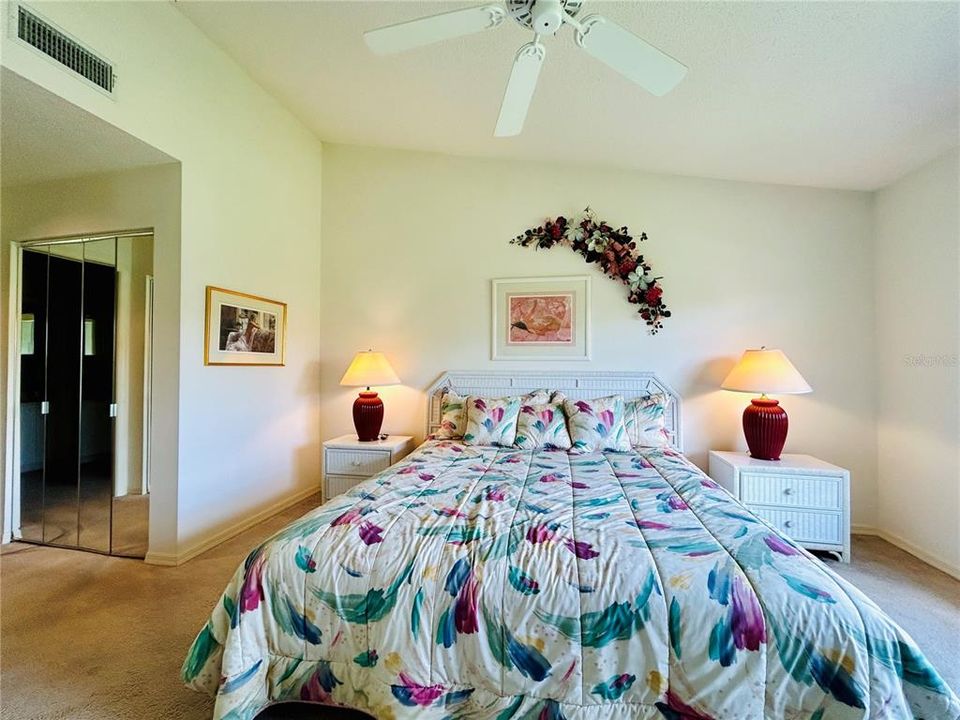 Main bedroom with hallway to dual closets.