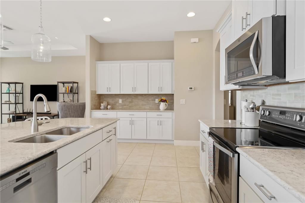 This kitchen has large counters for those who love to cook and entertain