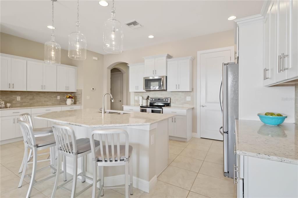 This kitchen has large counters for those who love to cook and entertain