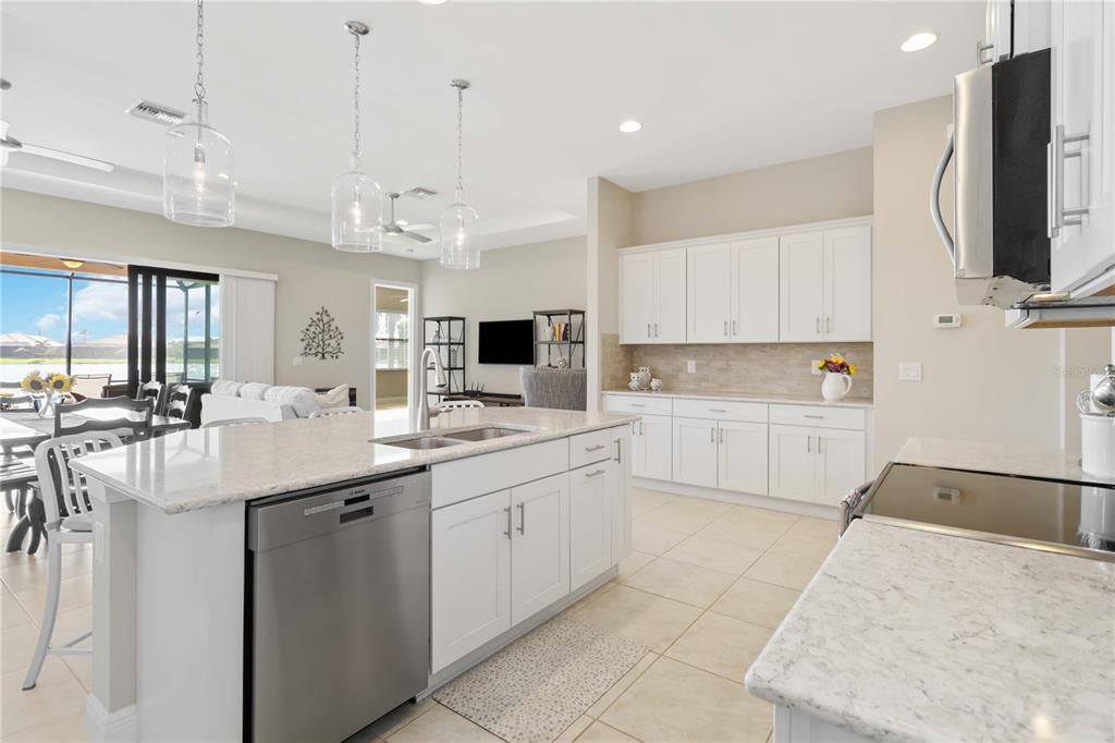 This kitchen has large counters for those who love to cook and entertain