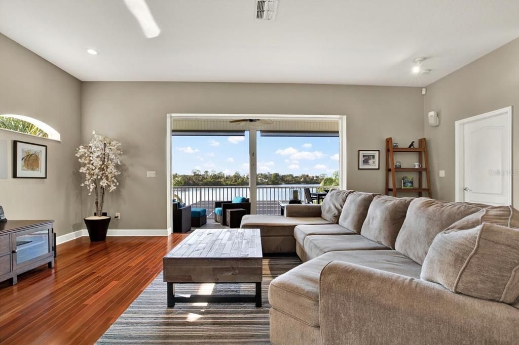 Living area out to screened porch overlooking Oyster Bayou!