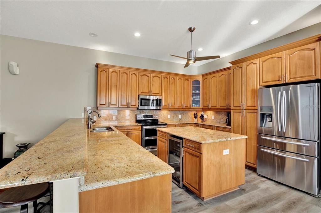 Breakfast bar and island with beverage refrigerator