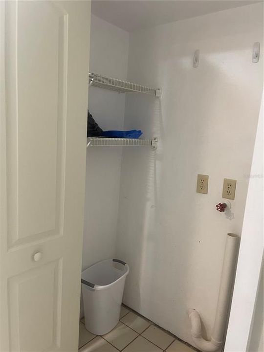 Utility closet off the kitchen with washer dryer hookups