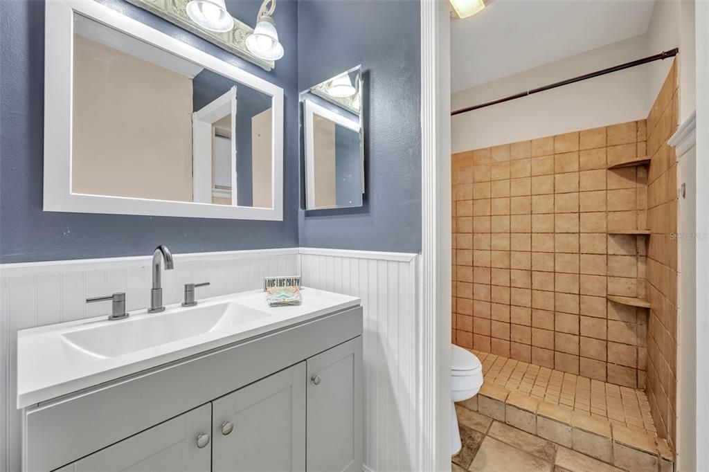 Primary bathroom with separate sink, so everyone can get ready at once :)