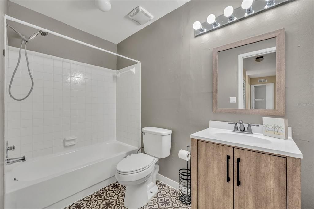 Beautiful, updated bathroom. Check out that vanity and tile!