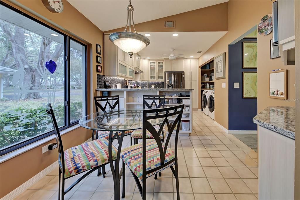 There is also room for breakfast table in the kitchen area.  Enjoy the mature landscaping view while eating a meal.