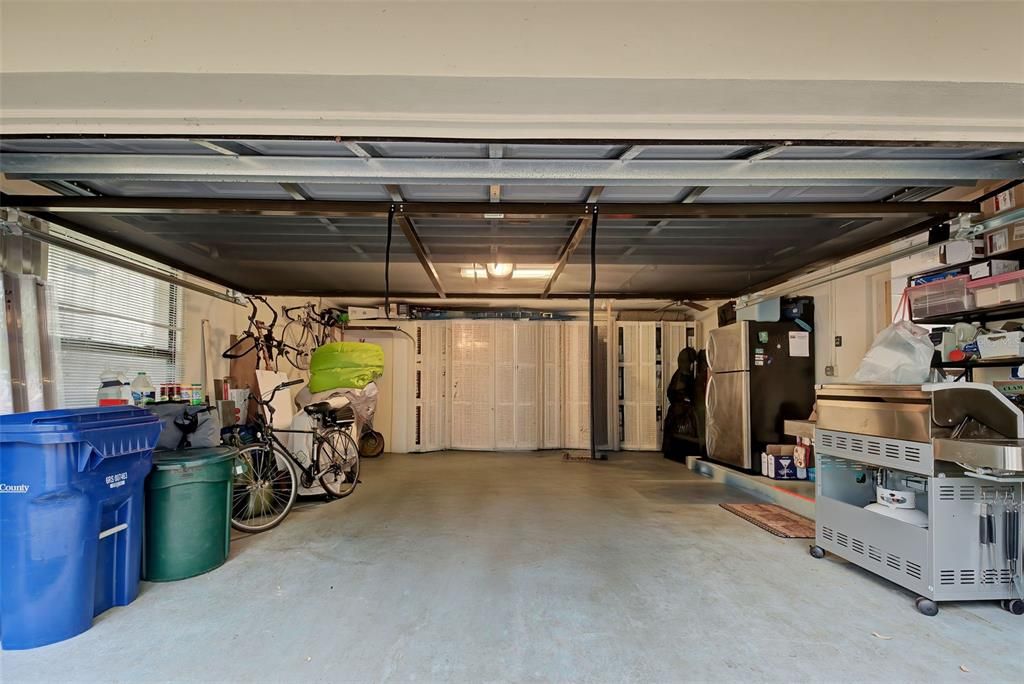 The garage is large with storage at the end.