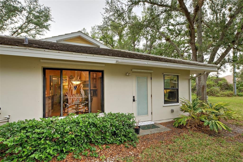 A view of the side of the home with the entry door into the flex space.