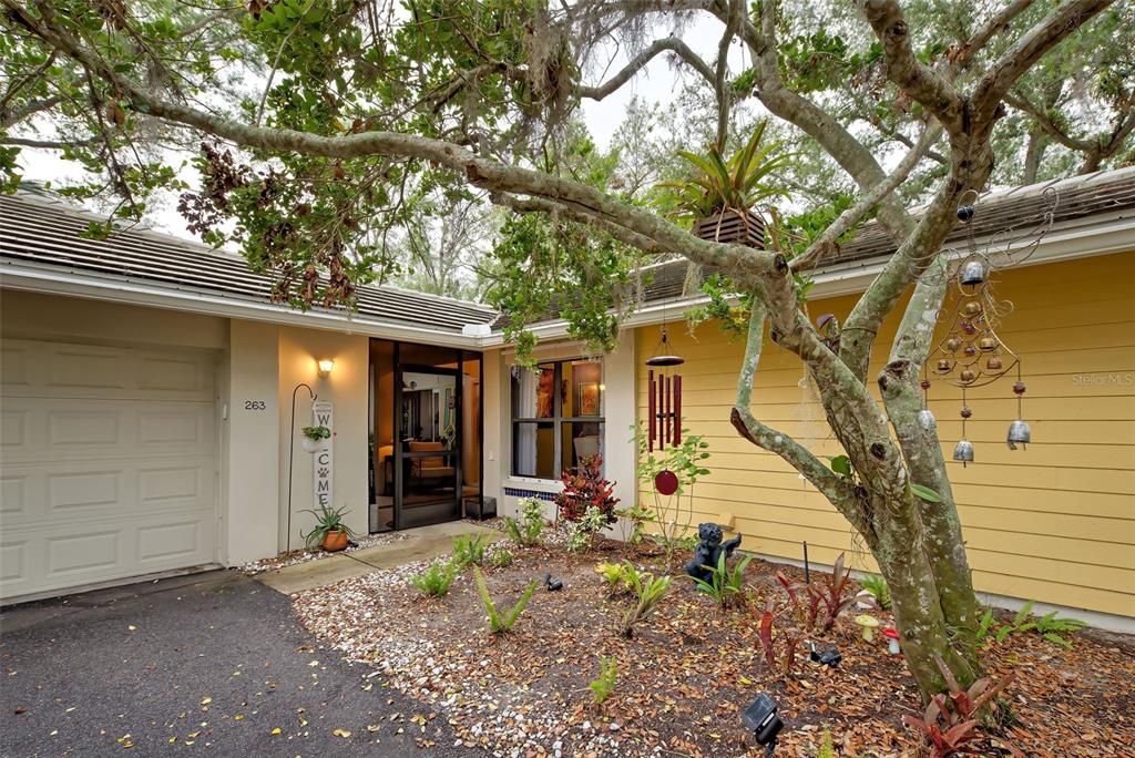 An inviting front door with tasteful landscaping.