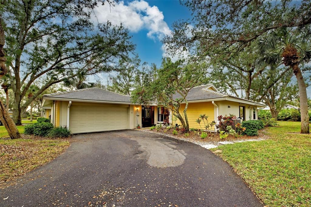 A beautiful villa with mature landscaping.  Great curb appeal.