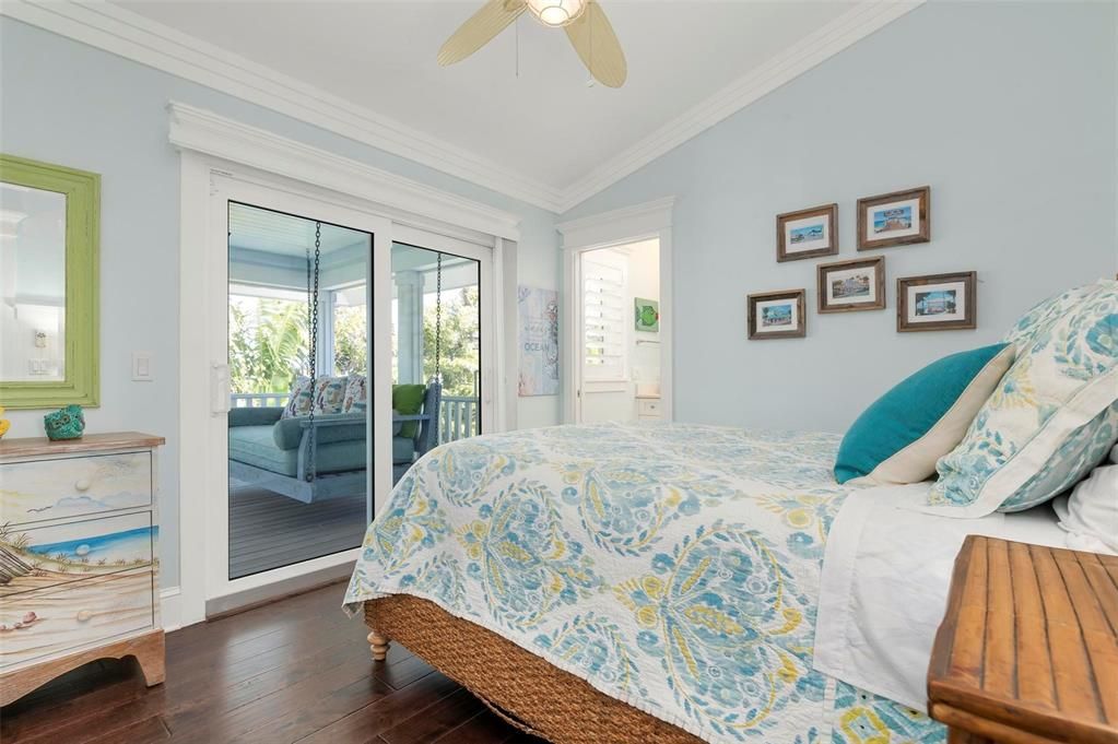 Bedroom 4 with ensuite bath and sliding doors to screened porch on third level