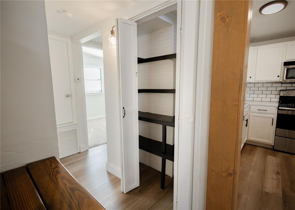 Pantry closet with lots of shelving