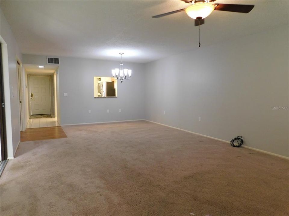 Primary bedroom with access to glass e nclosed lanai