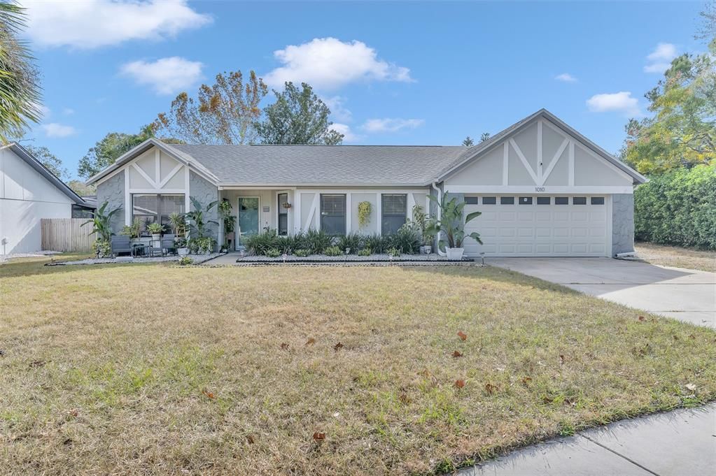 Exterior front. landscaped, newer exterior paint and door. Roof was replaced in 2021.