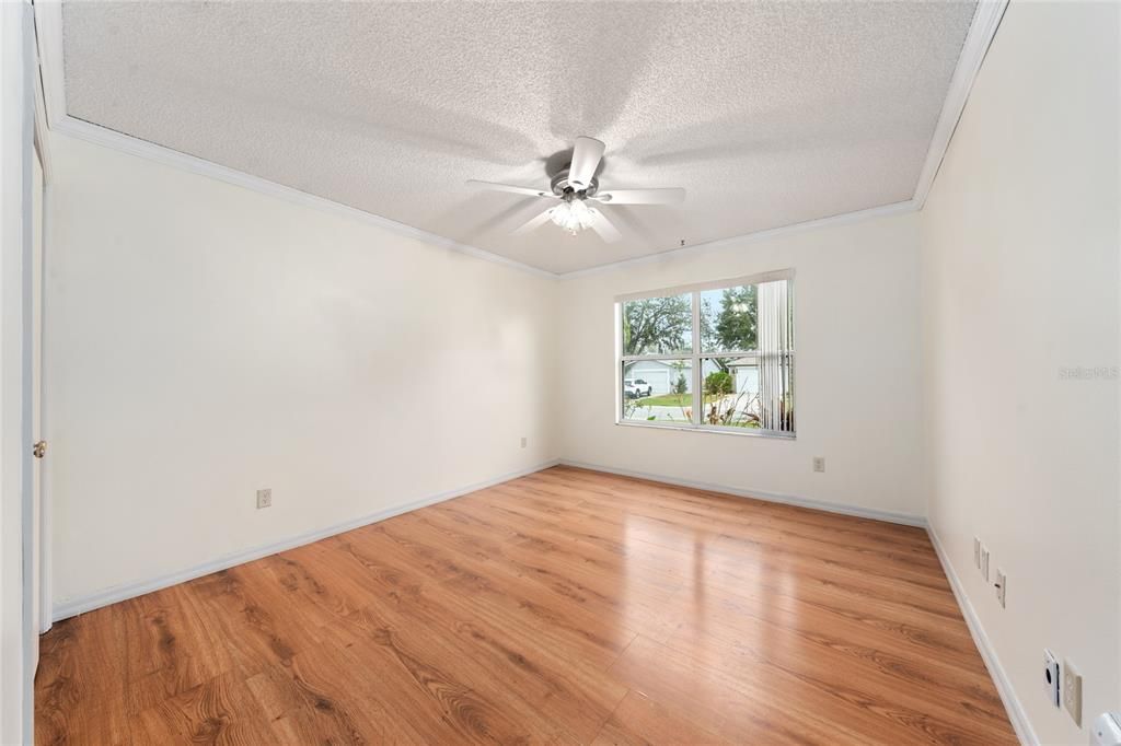 Primary Bedroom with view of backyard