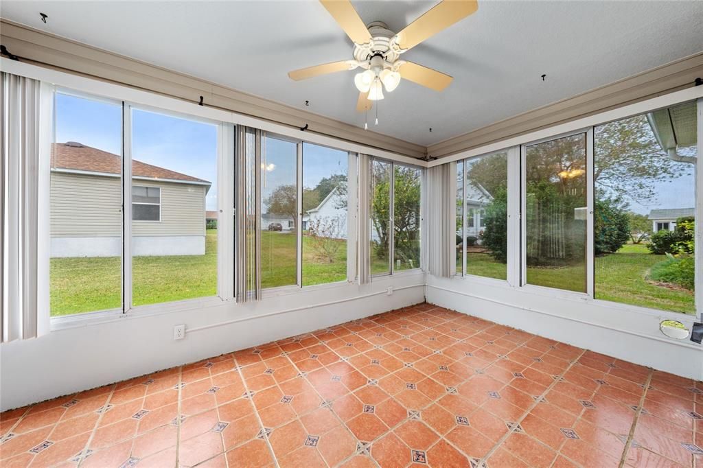 Enclosed Florida Room - custom tile floor, screened windows.