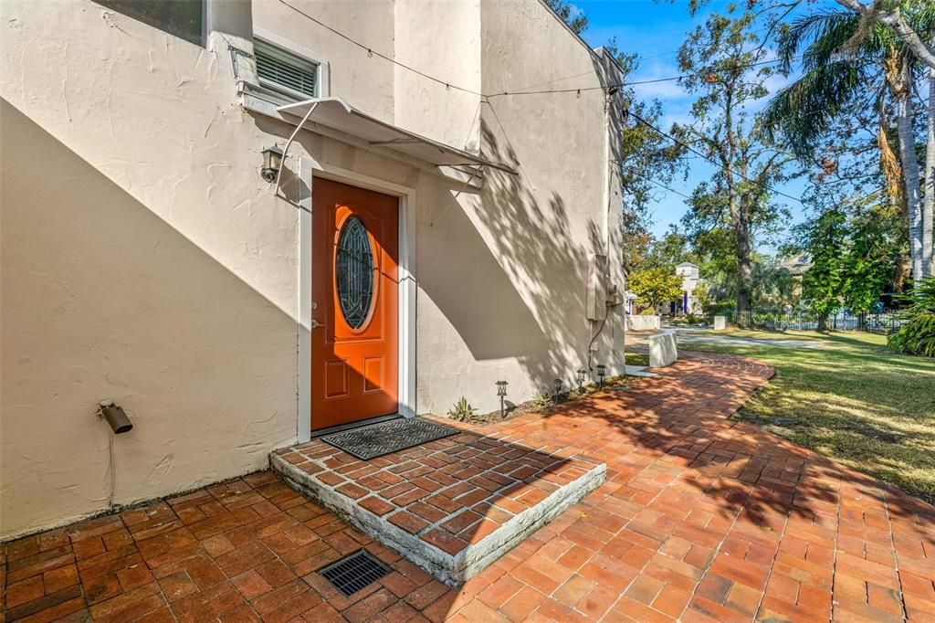 Front door opens onto a lighted patio.