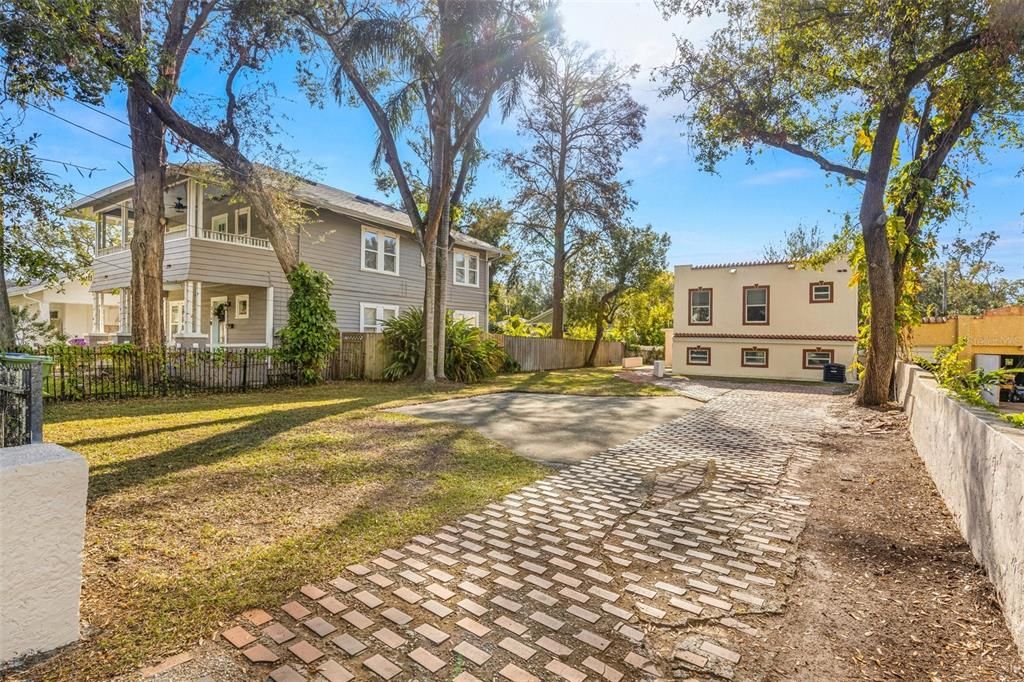 This home sits in the back of the property and has fencing or walls around the majority of the property. Only the driveway is open.