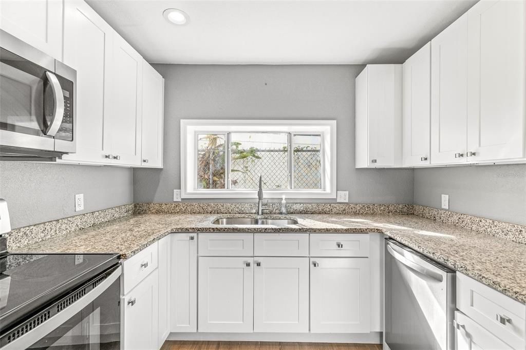 Doubled-sided stainless sink and dishwasher.