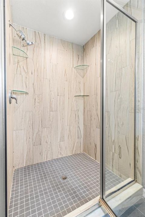 Tile surround and glass enclosure.