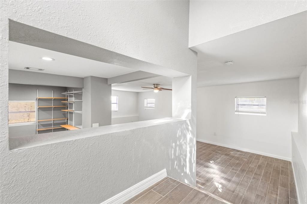 As you enter the front door you take a few steps down to the living space and kitchen with ceramic tile floors.