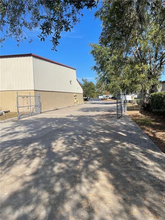 Fence/side of building to access rear parking