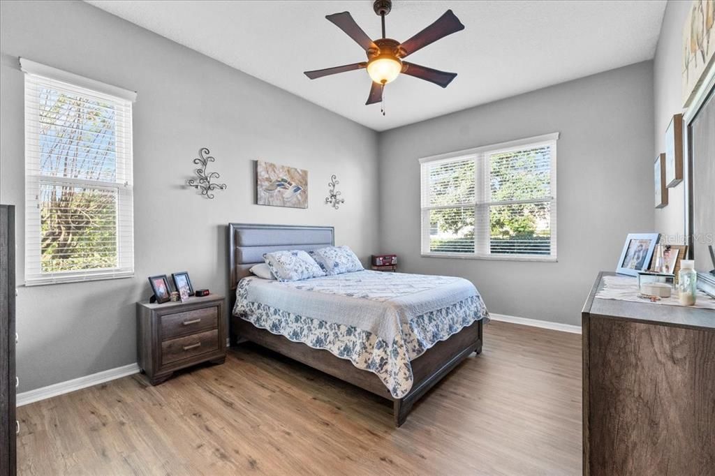 The large Second Bedroom has luxury vinyl plank floors and a garden view Northward and Eastward.