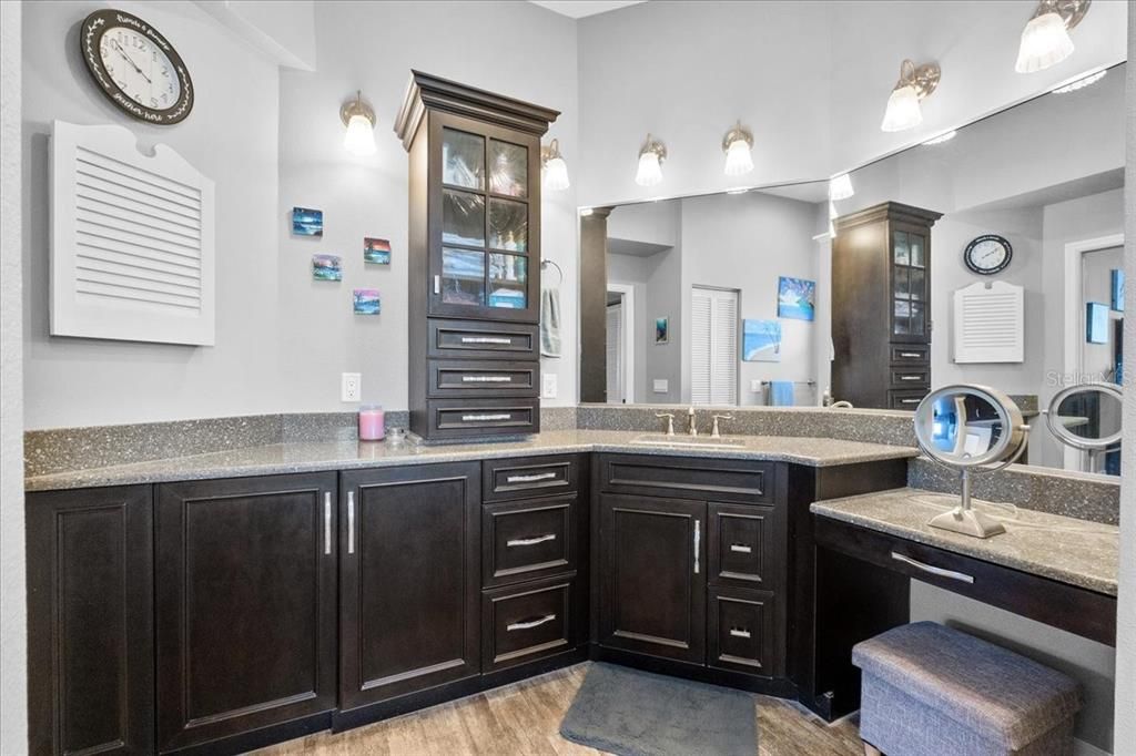 This is the Owner's Oasis Ensuite Bath, with ceramic tile flooring, a tub/shower combo, a makeup station, lots of light, a linen closet, and a very upscale above-counter cabinet for all the quick access items you can think of.